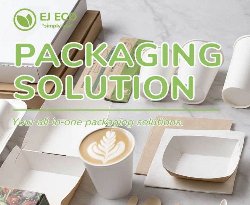 Eco-friendly packaging solutions with cups, plates, and cutlery on a table.